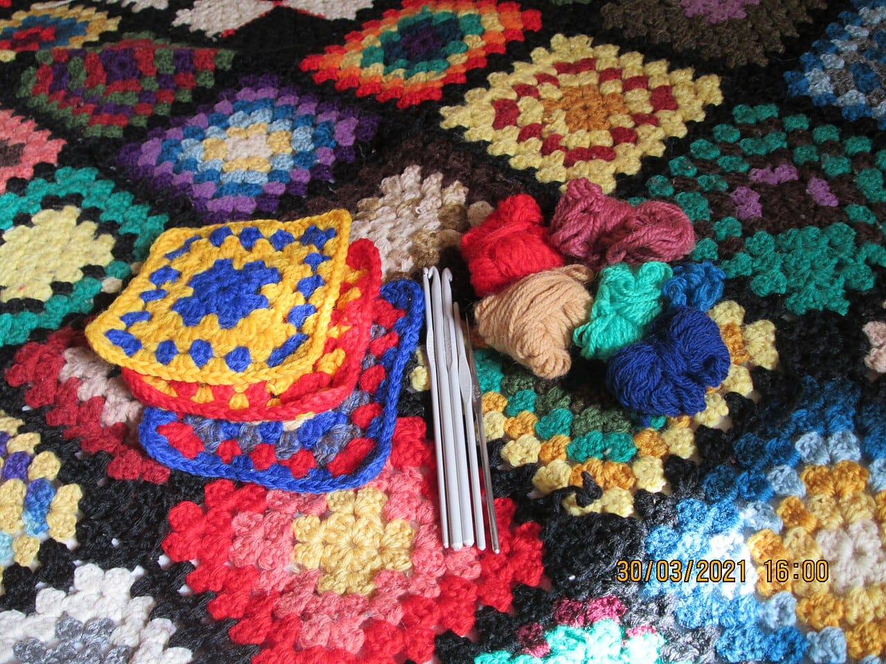 Cozy handmade crochet granny square blanket